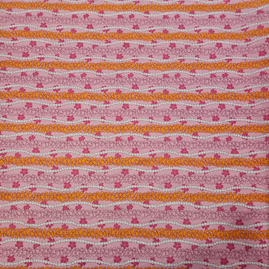 Patterned floral fabric with vertical floral stripes on a pink background