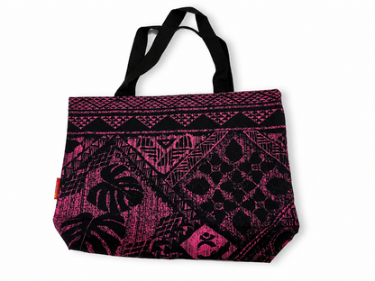 A tote bag with a black and vibrant pink geometric and tribal-inspired pattern, featuring black shoulder straps, shown on a plain white background.