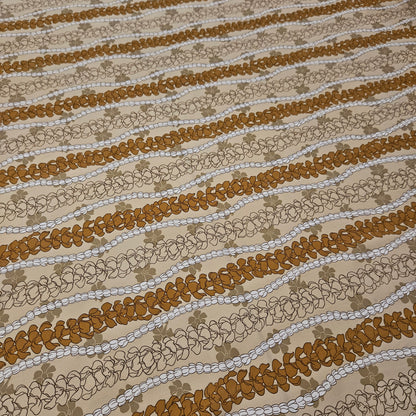 Textured fabric with wavy brown and beige floral pattern