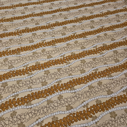 Textured fabric with wavy brown and beige floral pattern