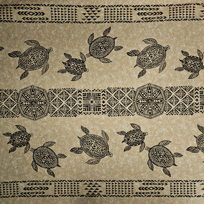 Patterned fabric with turtles and tribal designs on a beige background