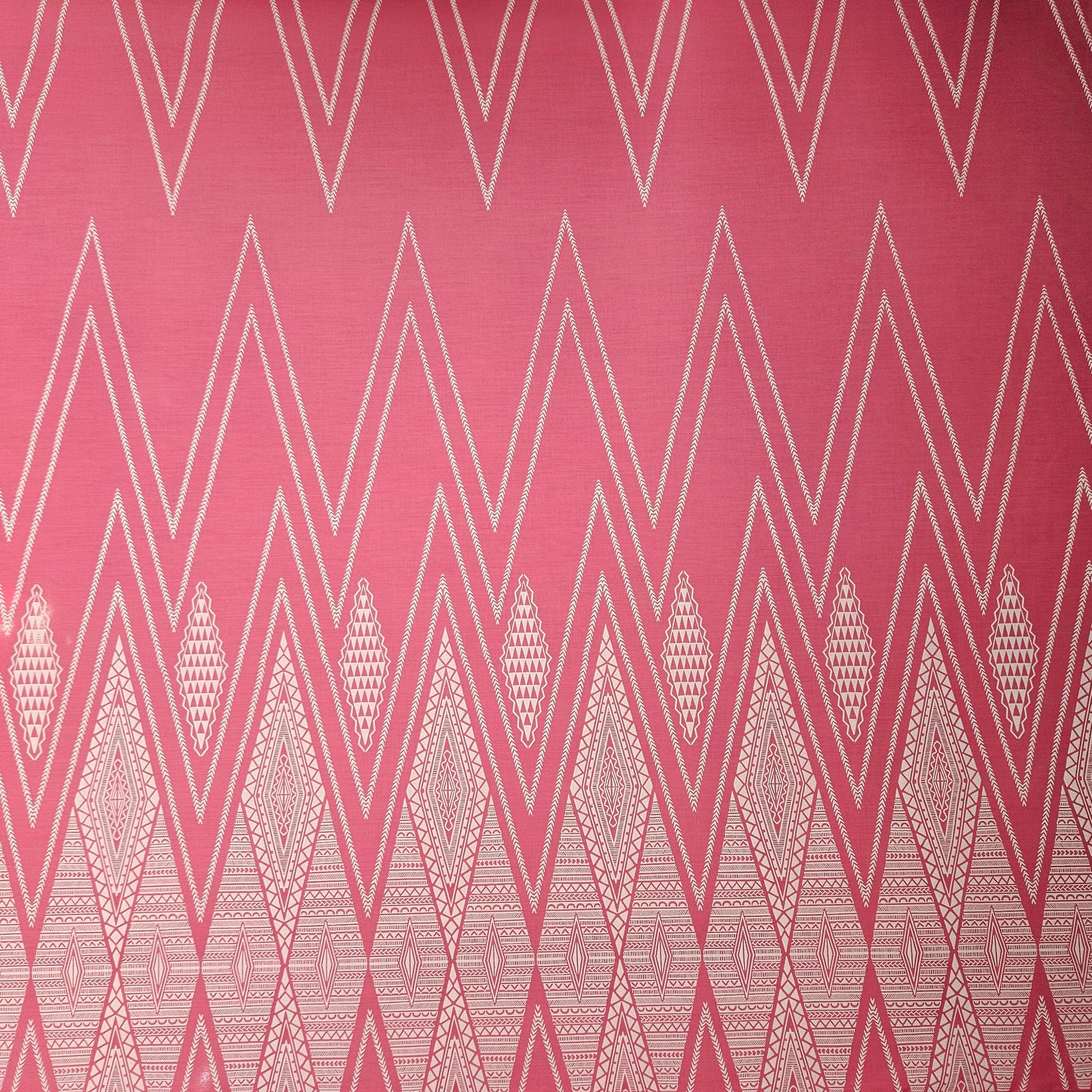 Geometric pattern with white triangles on a pink background