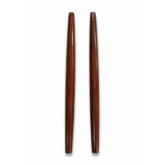 A pair of dark reddish-brown wooden drumsticks with a glossy finish, standing vertically against a plain white background.