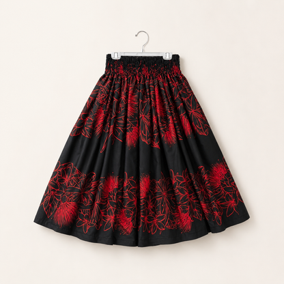 Black skirt with red floral pattern on a white background